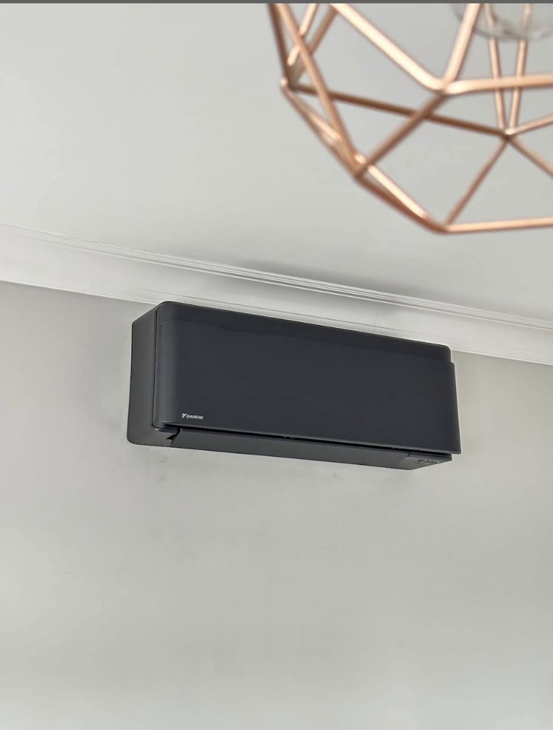 Matte black Daikin indoor air conditioner unit installed in Birmingham home